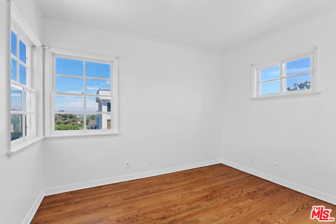 3851 Olympiad Drive View Park, CA 90043 - Photo 22 of 35 a view of an empty room with a window