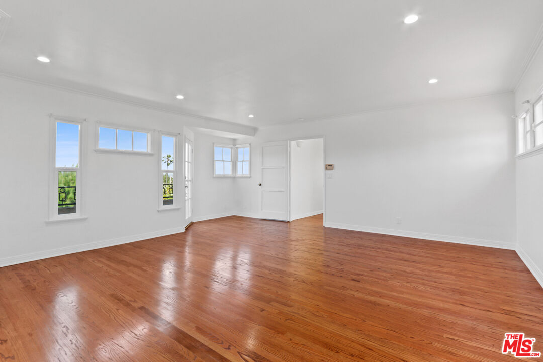 3851 Olympiad Drive View Park, CA 90043 - Photo 26 of 35 a view of empty room with wooden floor and window