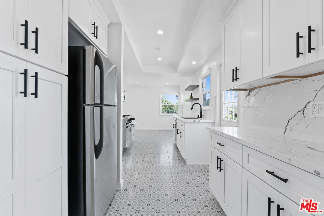3851 Olympiad Drive View Park, CA 90043 - Photo 5 of 35 a view of a kitchen with a sink