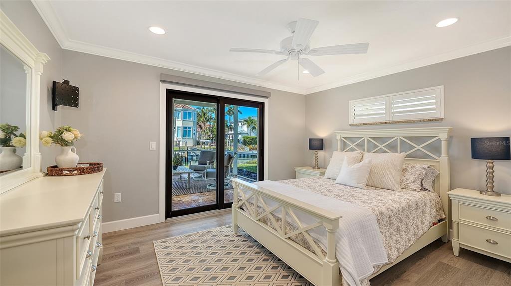 595 Bowsprit Lane Longboat Key, FL 34228 - Photo 17 of 31 a bedroom with a large bed and a window
