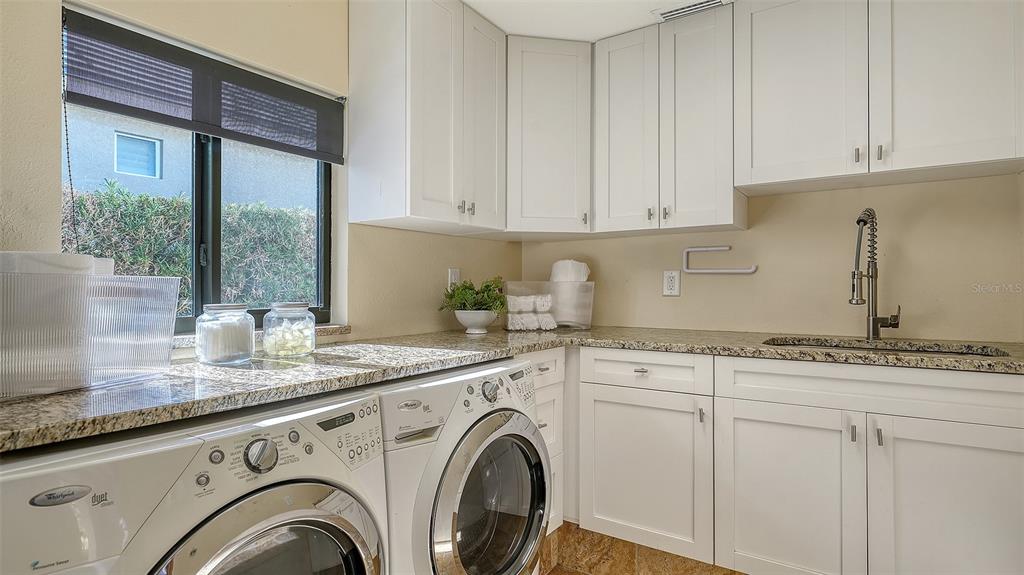 595 Bowsprit Lane Longboat Key, FL 34228 - Photo 20 of 31 a view of kitchen with granite countertop cabinets