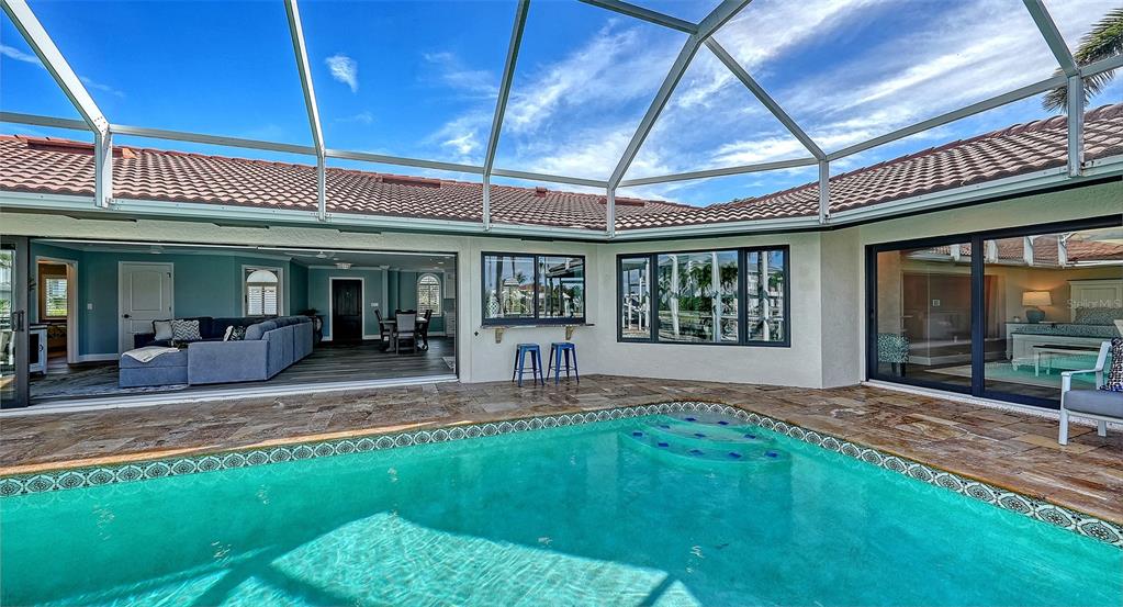595 Bowsprit Lane Longboat Key, FL 34228 - Photo 23 of 31 a view of a dinning room with a patio