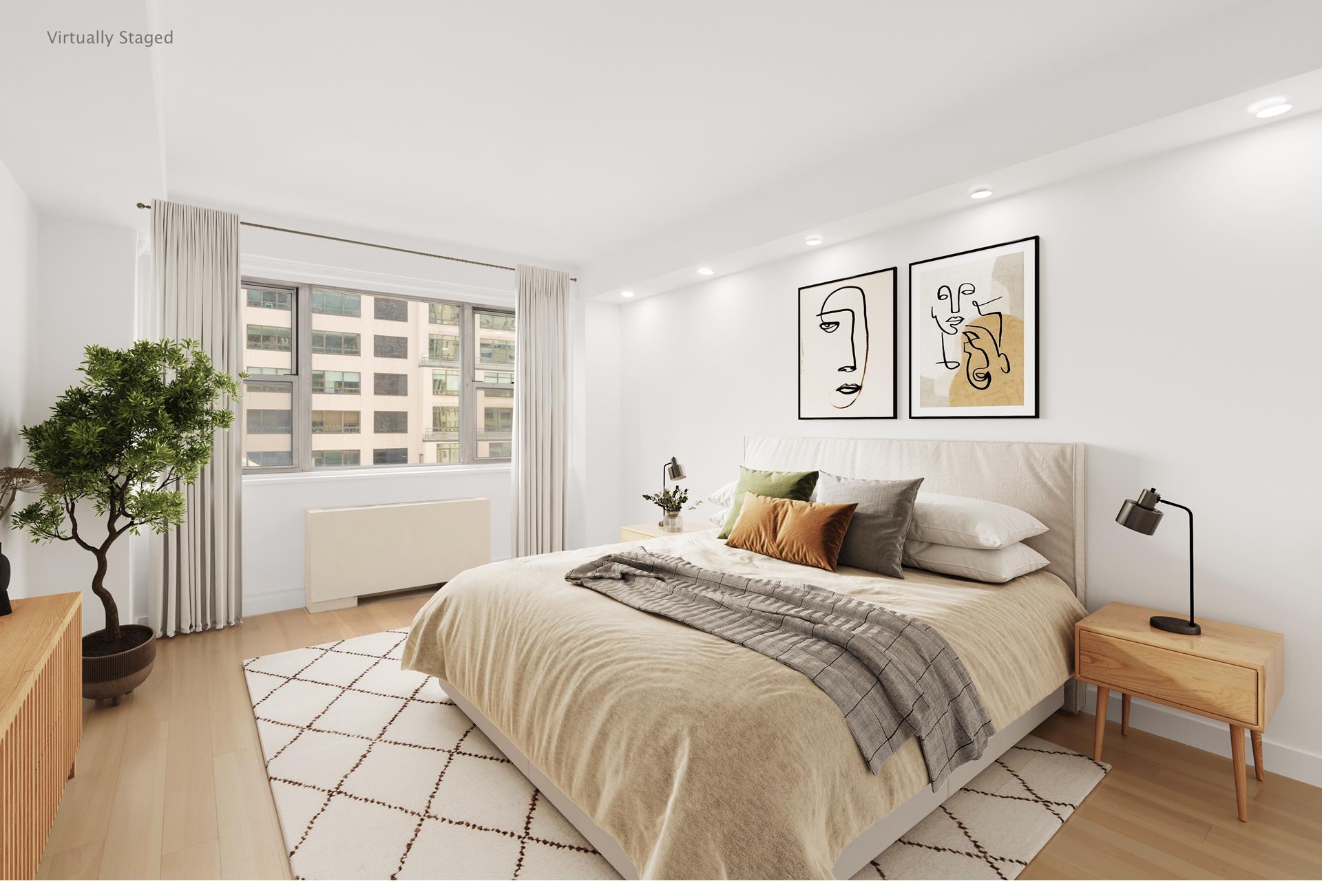 a bedroom with a large bed and a window