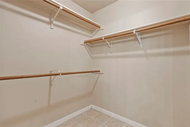 a view of an empty walk in closet