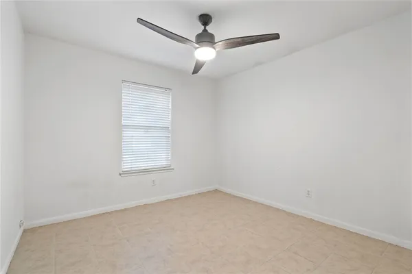 a view of a backyard with plants and a patio