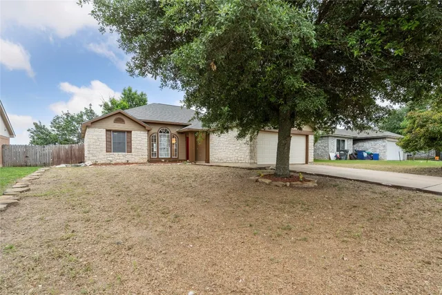a house with trees in front of it