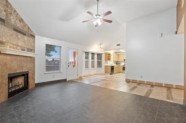 a view of an empty room with a fireplace