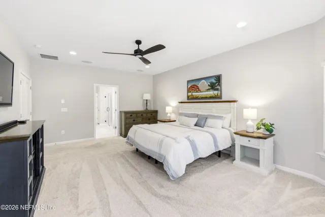 a spacious bathroom with a double vanity sink and a mirror