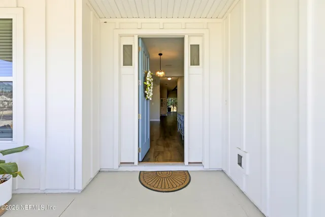a view of a bathroom with sink and mirror