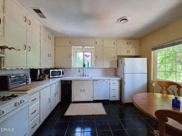 a kitchen with a sink and a window