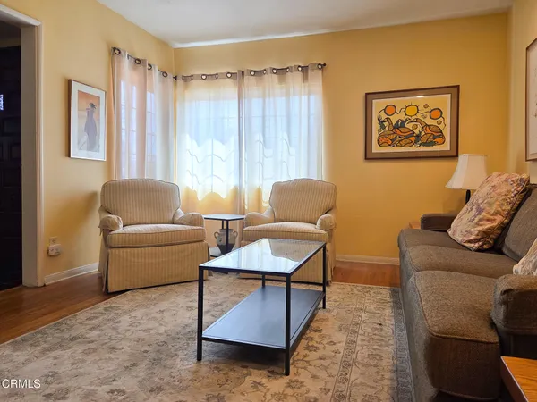 a living room with furniture and a couch