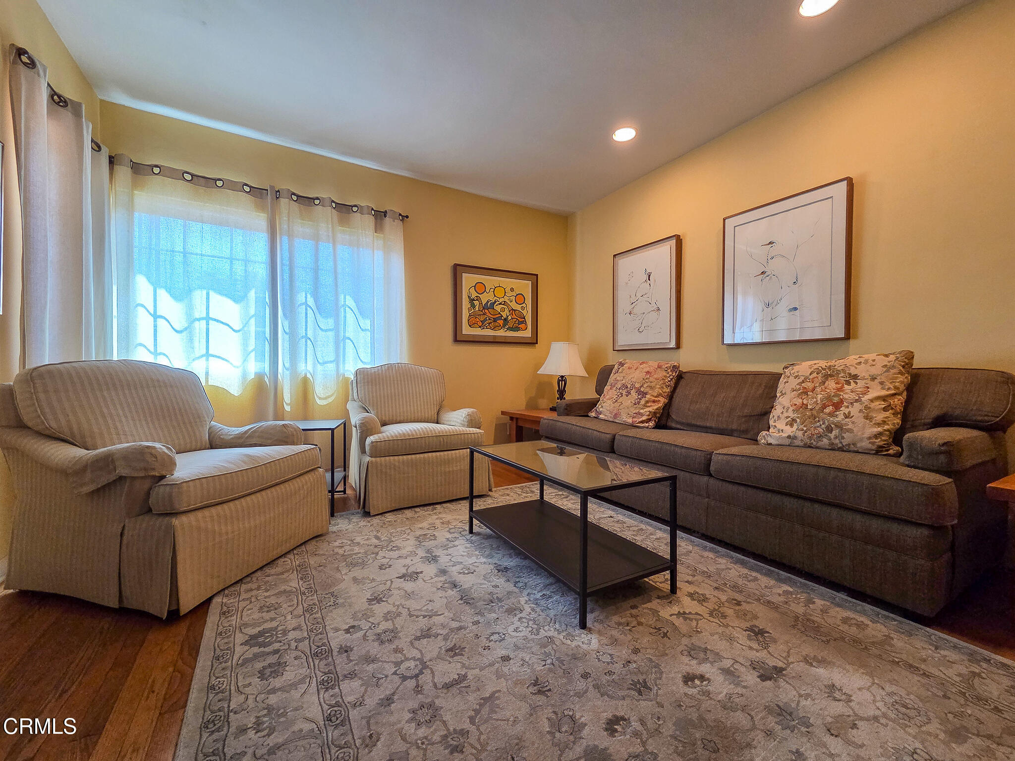 14135 Hatteras Street Sherman Oaks, CA 91401 - Photo 21 of 39 a living room with furniture and a large window