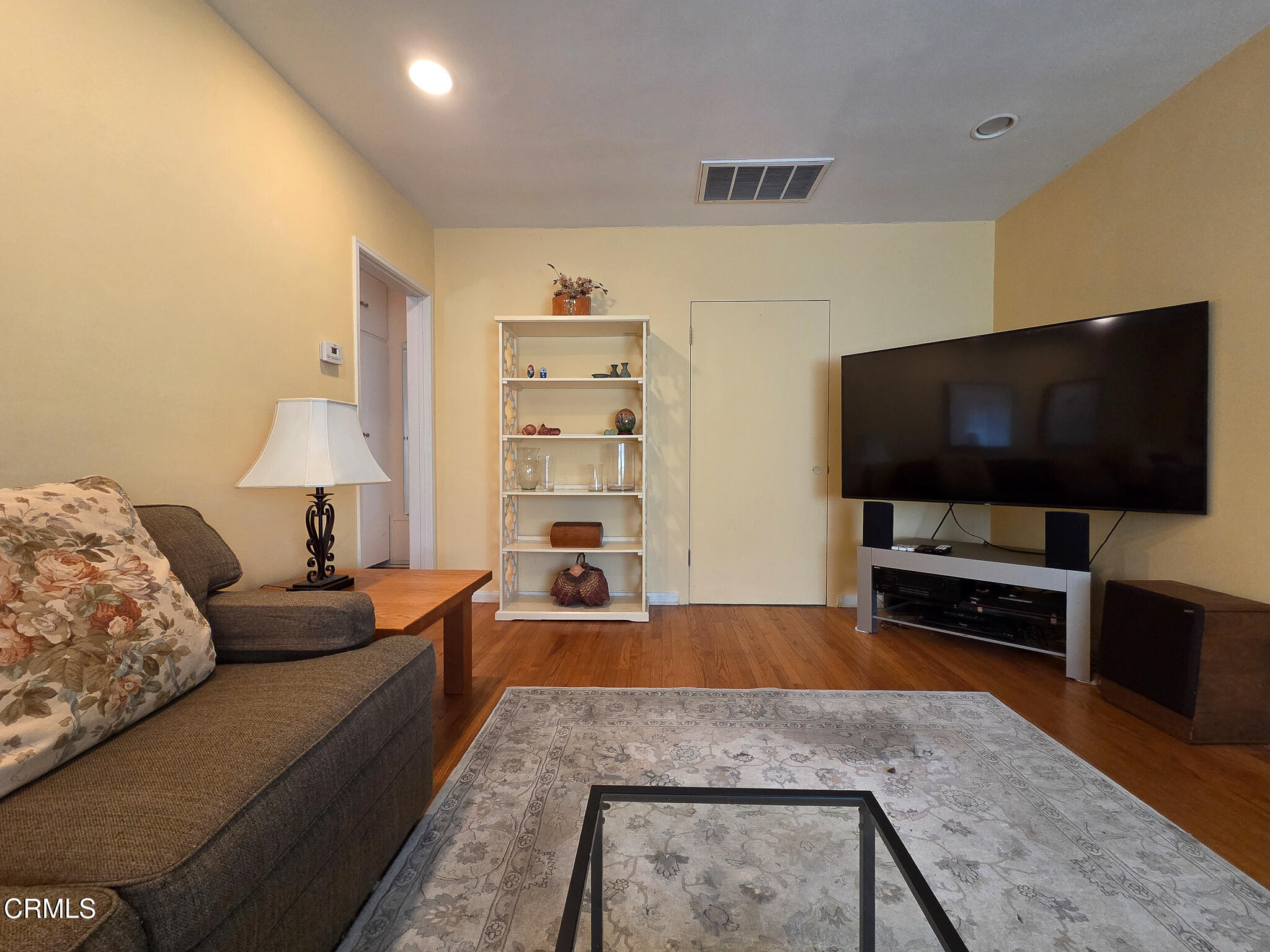 14135 Hatteras Street Sherman Oaks, CA 91401 - Photo 22 of 39 a living room with furniture and a flat screen tv