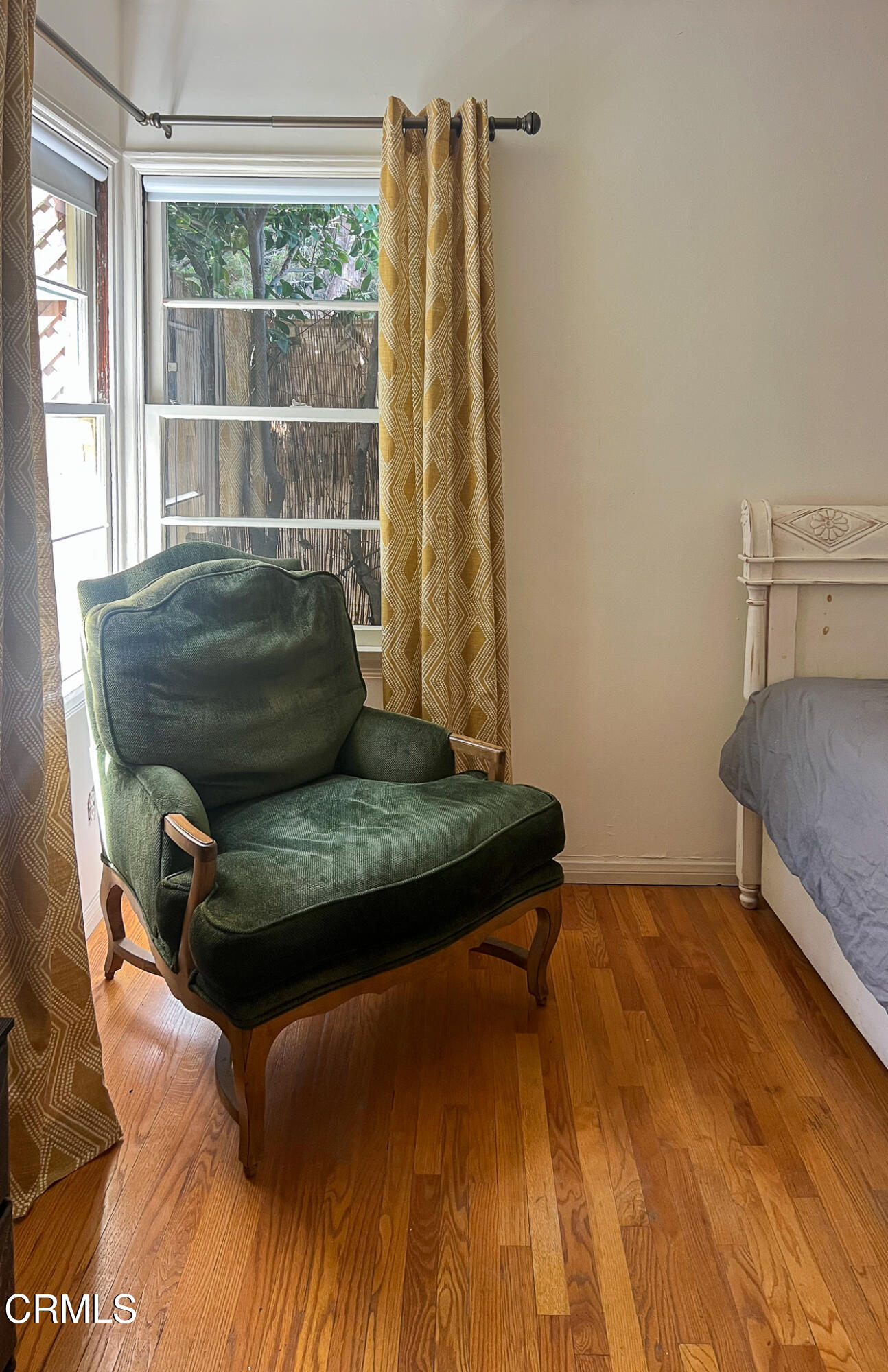 14135 Hatteras Street Sherman Oaks, CA 91401 - Photo 29 of 39 a living room with a bed and a window