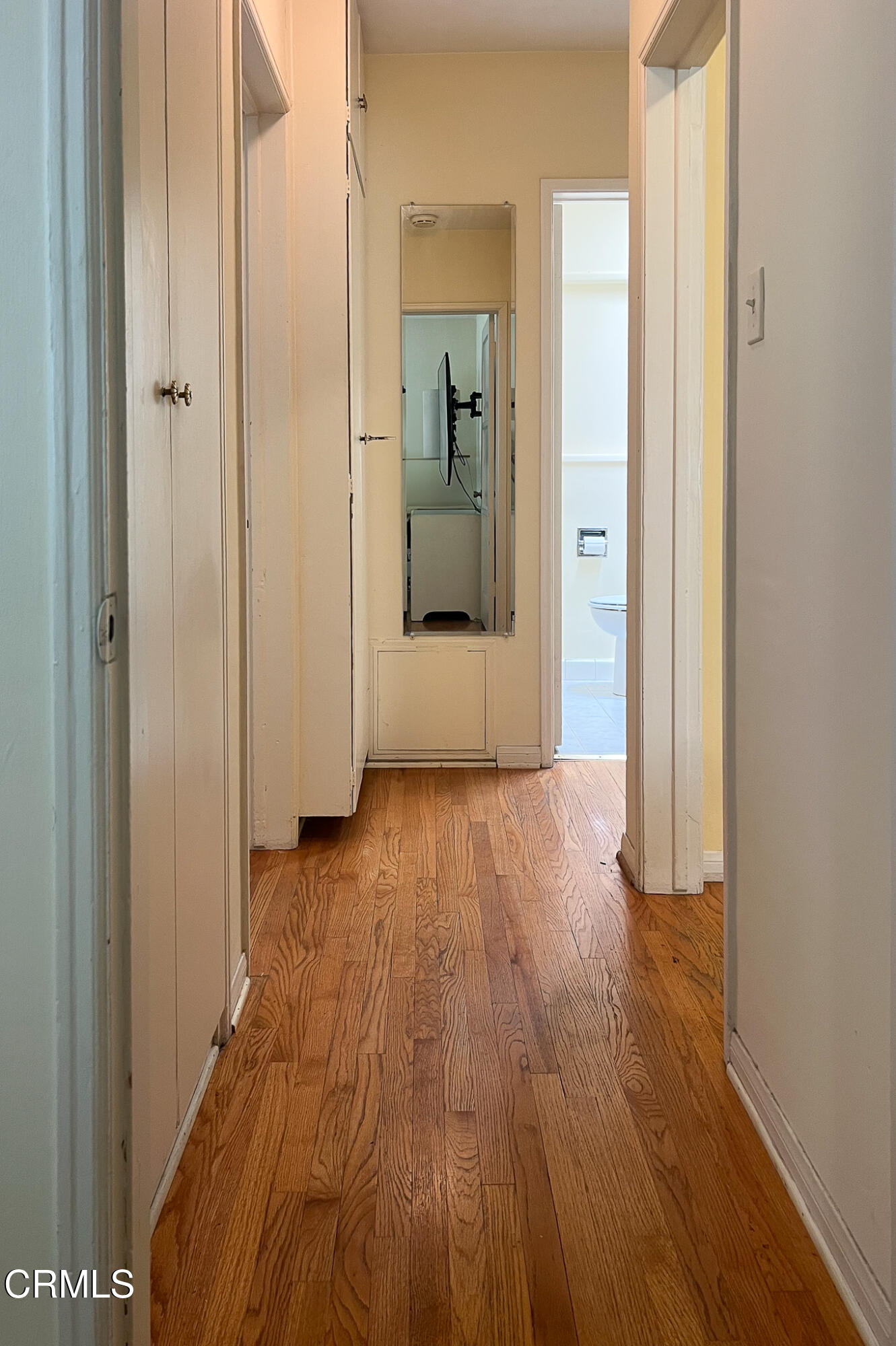 14135 Hatteras Street Sherman Oaks, CA 91401 - Photo 33 of 39 a view of a hallway with wooden floor