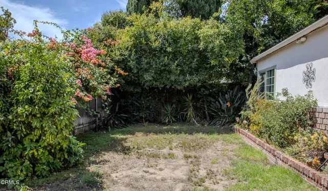 a view of a patio with a table and chairs