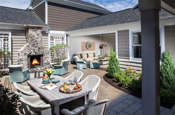 a outdoor space with furniture and a fireplace