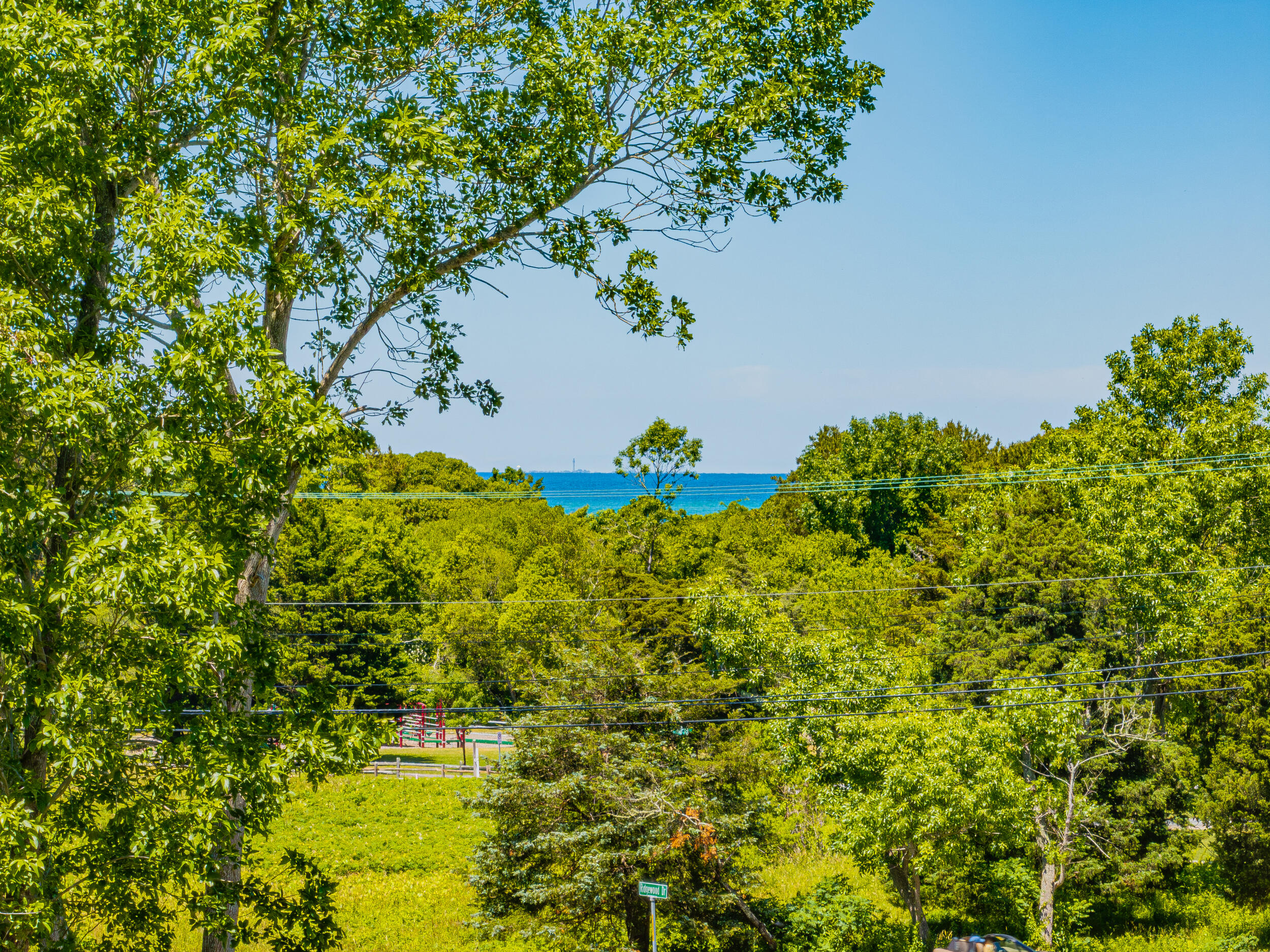 0 Ridgewood Drive Brewster, MA 02631 - Photo 4 of 42 a view of a lake with a flower garden