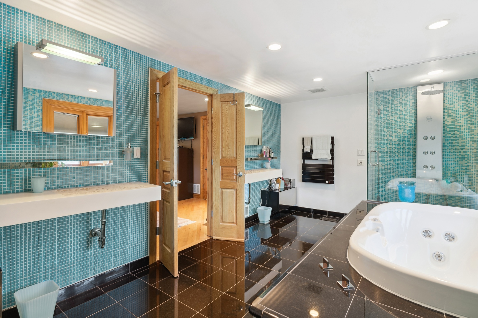 3731 Winnetka Road Glenview, IL 60026 - Photo 11 of 26 a large bathroom with a tub a double vanity sink a mirror and shower