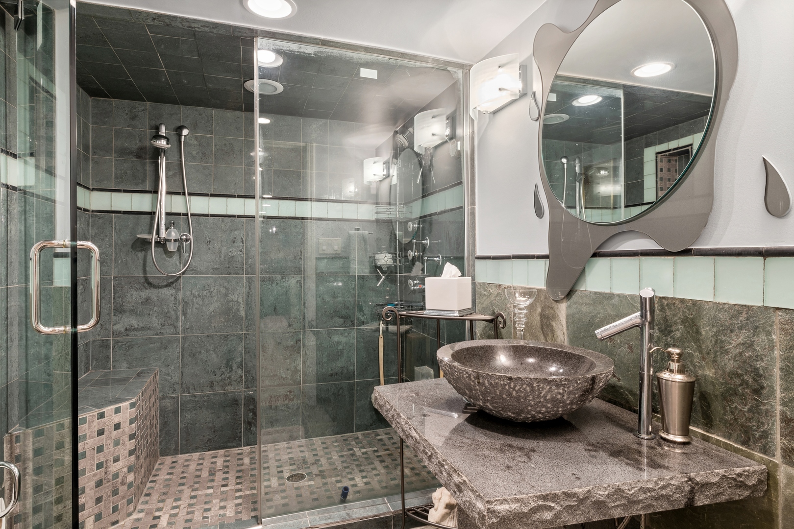 3731 Winnetka Road Glenview, IL 60026 - Photo 17 of 26 a bathroom with a granite countertop sink a mirror and shower