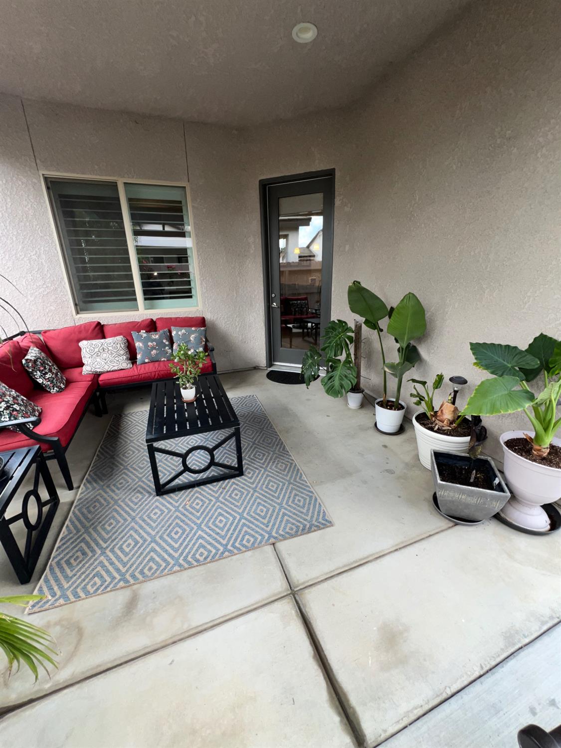 889 Coloma Place Madera, CA 93637 - Photo 55 of 61 a living room with furniture and a potted plant