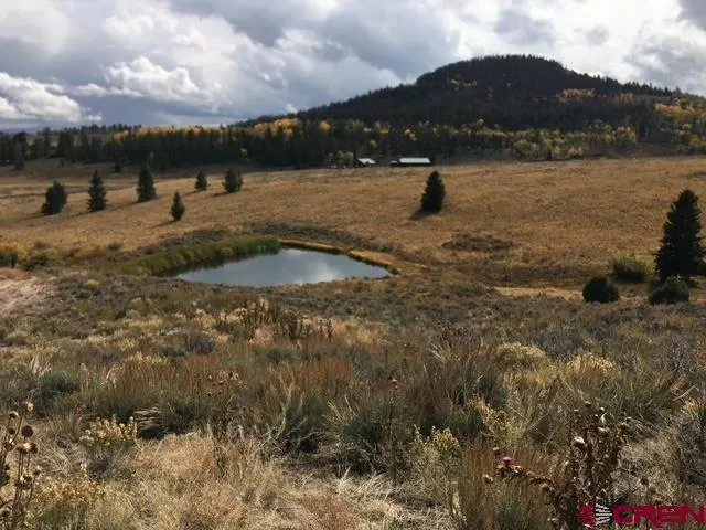 a view of an ocean and a mountain