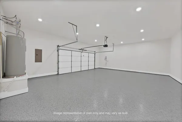 an empty room with windows and pillars in it