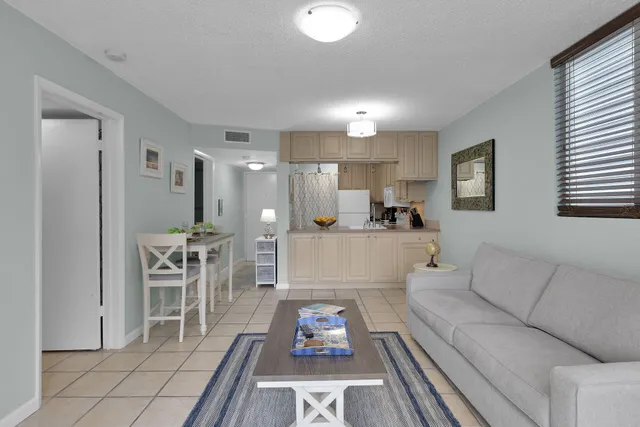 a living room with furniture and a table