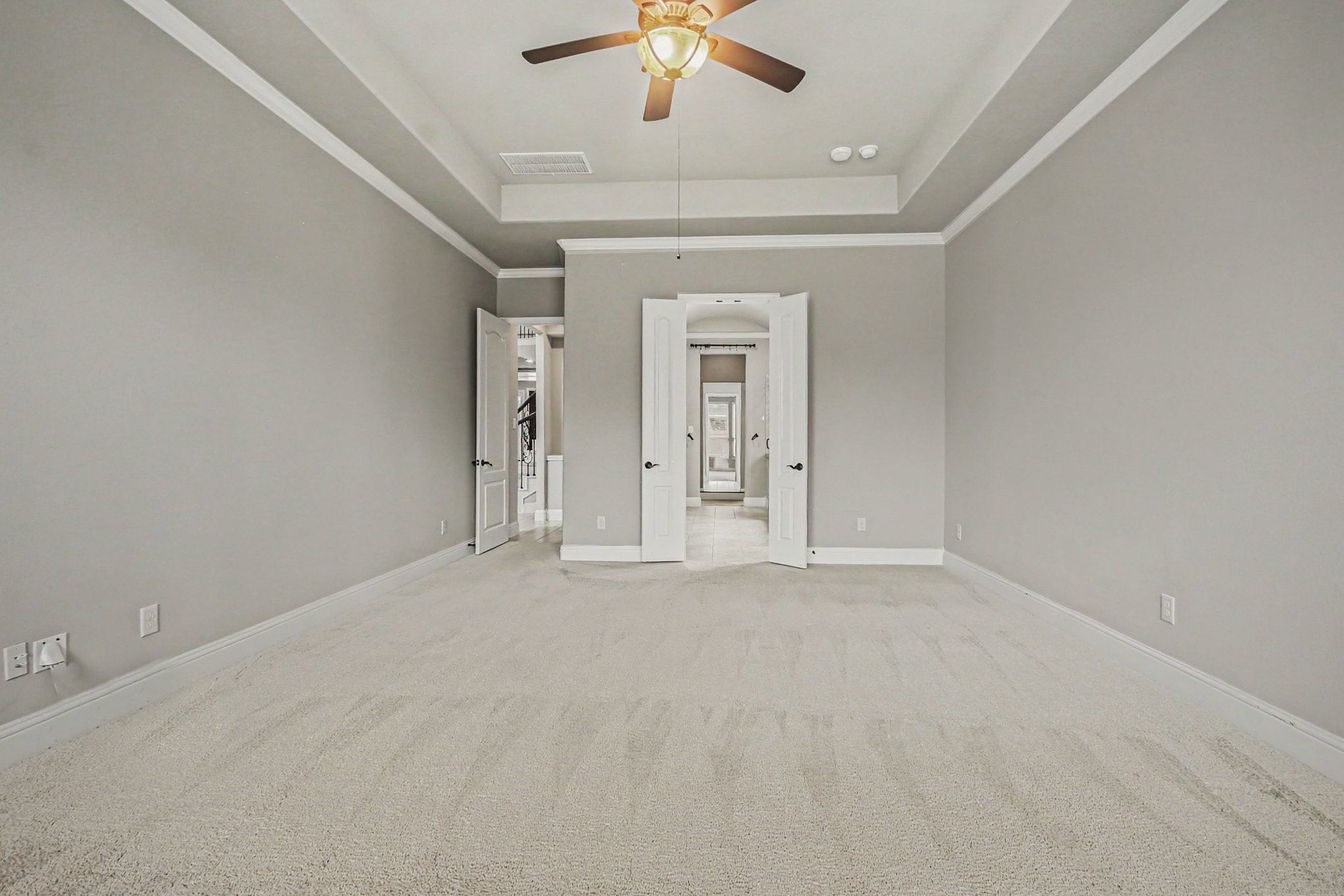 3310 Ralston Edge Lane Houston, TX 77059 - Photo 26 of 50 an empty room with chandelier fan and windows
