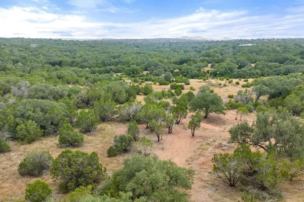 a view of a lake with green field