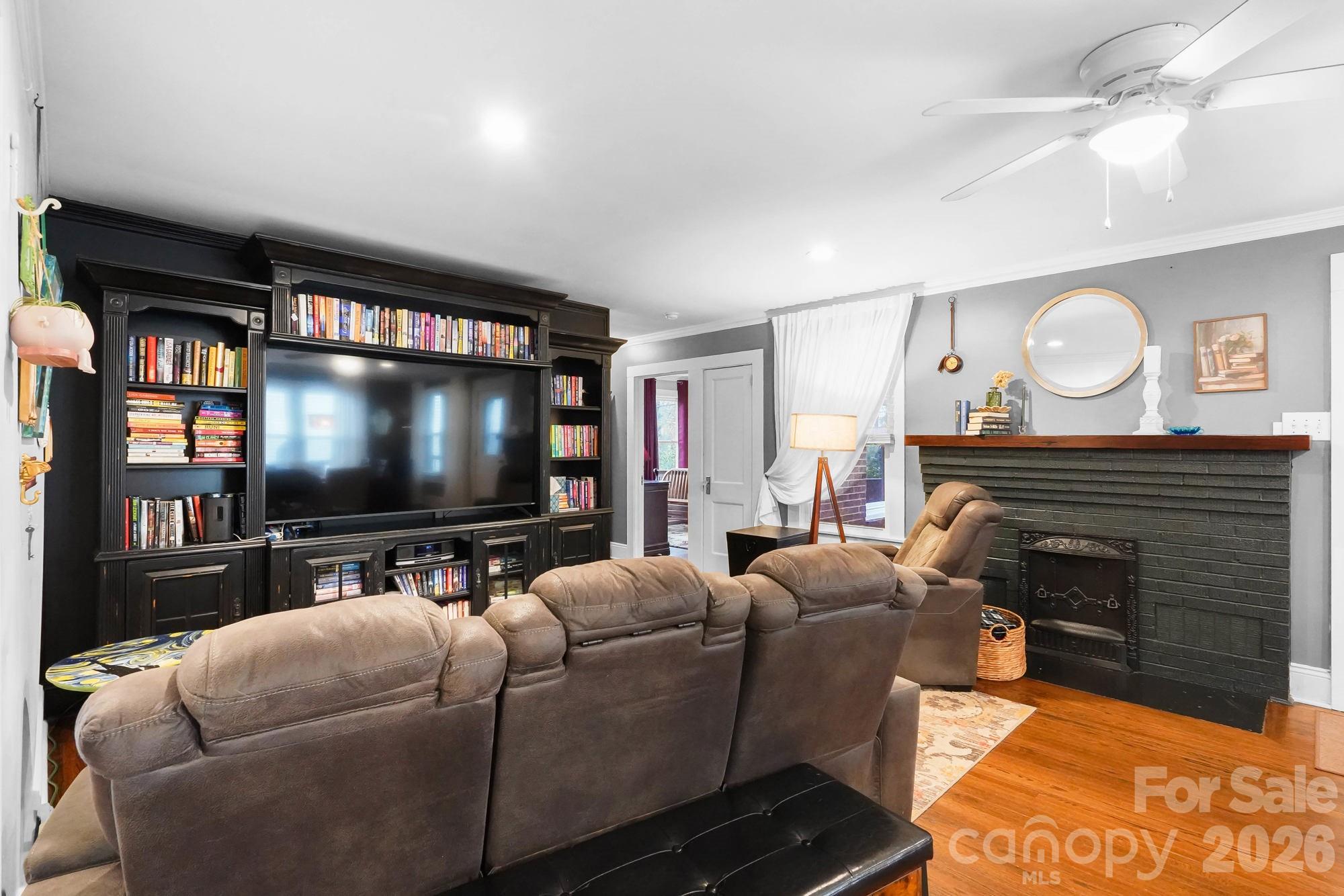 514 Jackson Park Road Kannapolis, NC 28083 - Photo 12 of 48 a living room with fireplace furniture and a flat screen tv