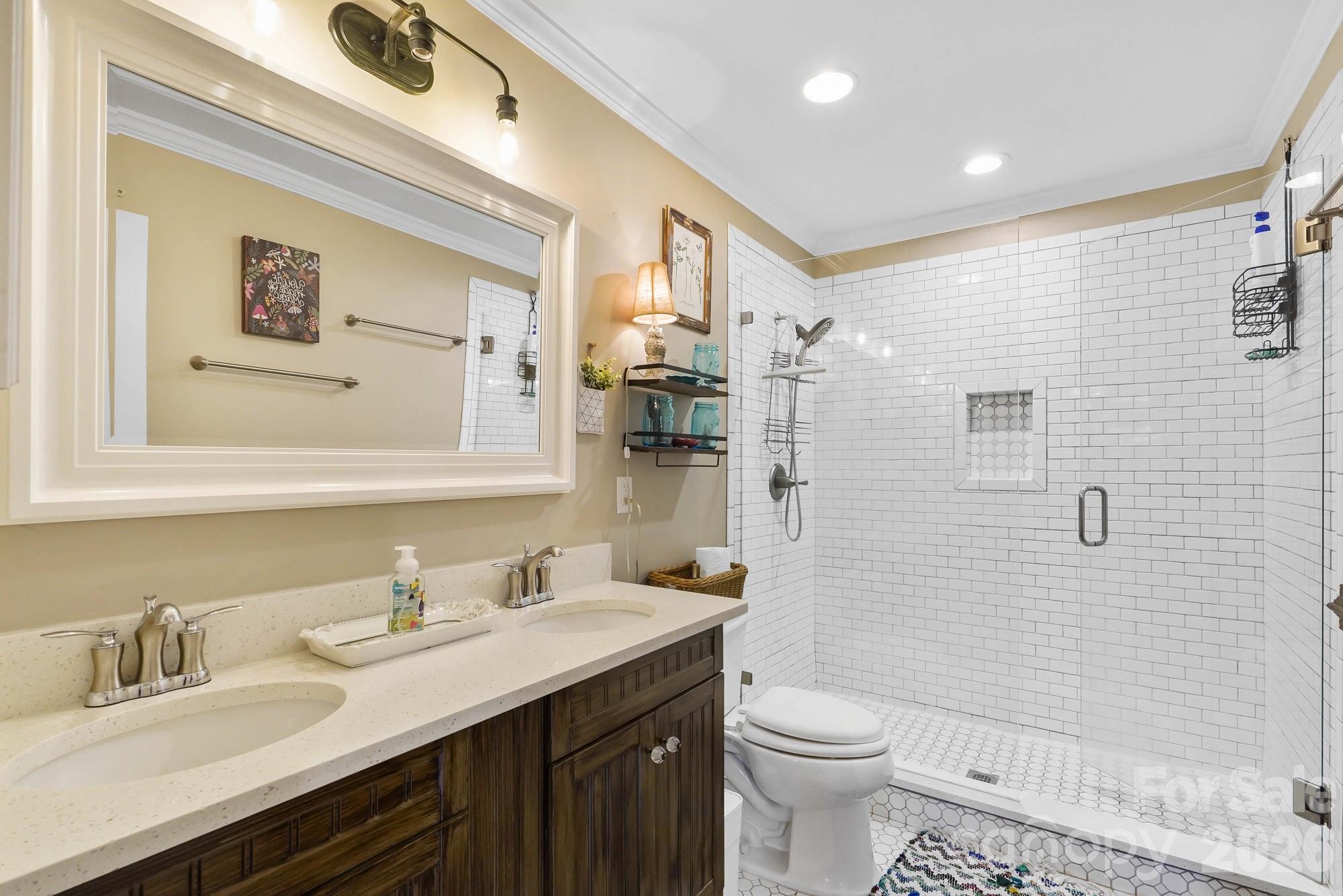 514 Jackson Park Road Kannapolis, NC 28083 - Photo 16 of 48 a bathroom with a granite countertop sink toilet and shower