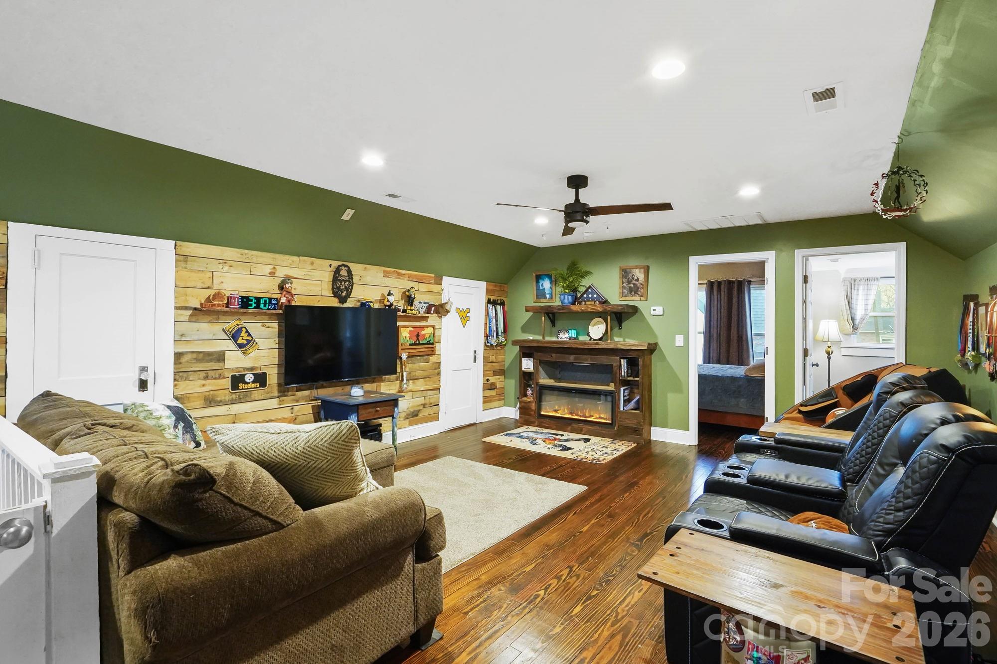 514 Jackson Park Road Kannapolis, NC 28083 - Photo 22 of 48 a living room with furniture and a flat screen tv