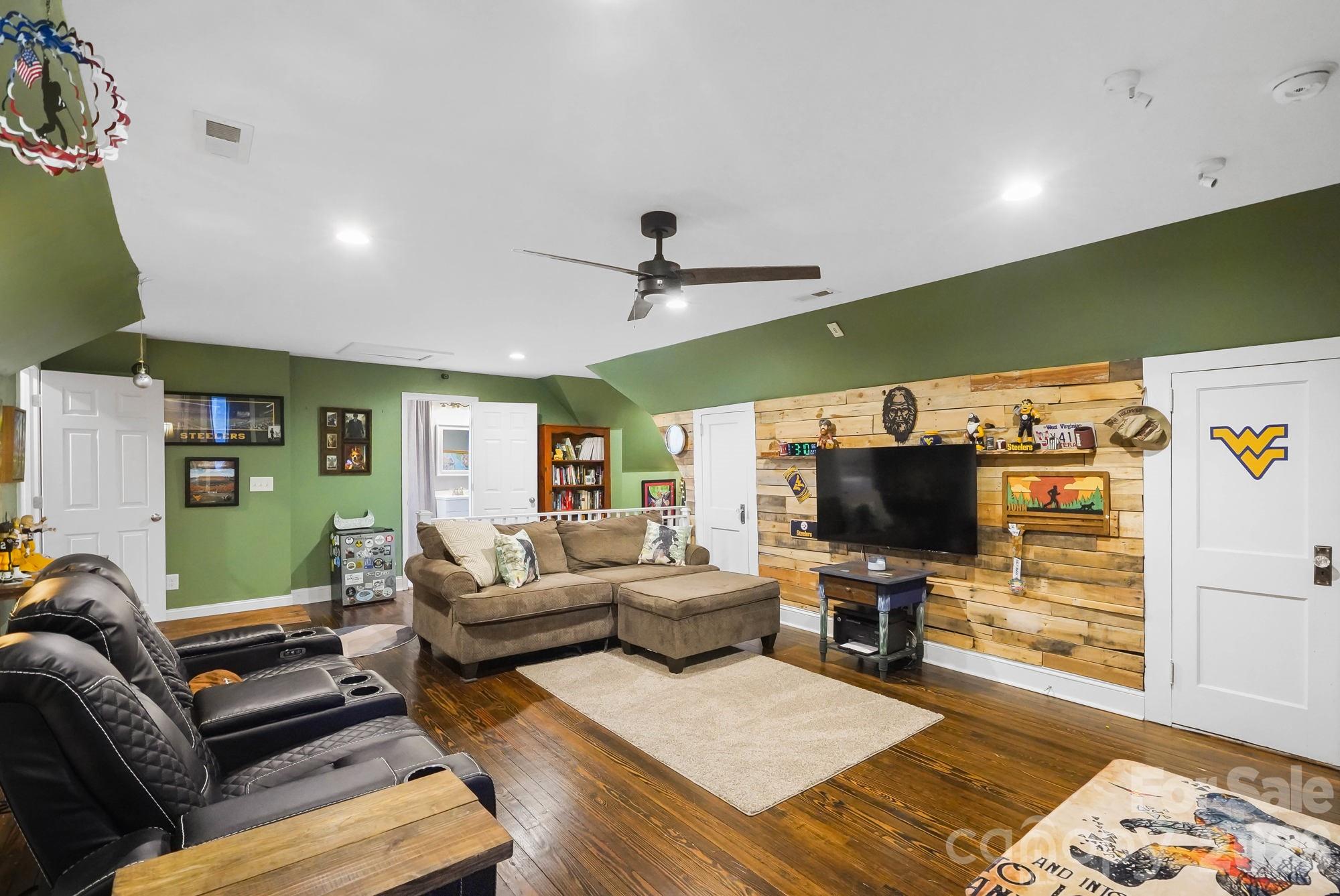 514 Jackson Park Road Kannapolis, NC 28083 - Photo 23 of 48 a living room with furniture and a flat screen tv