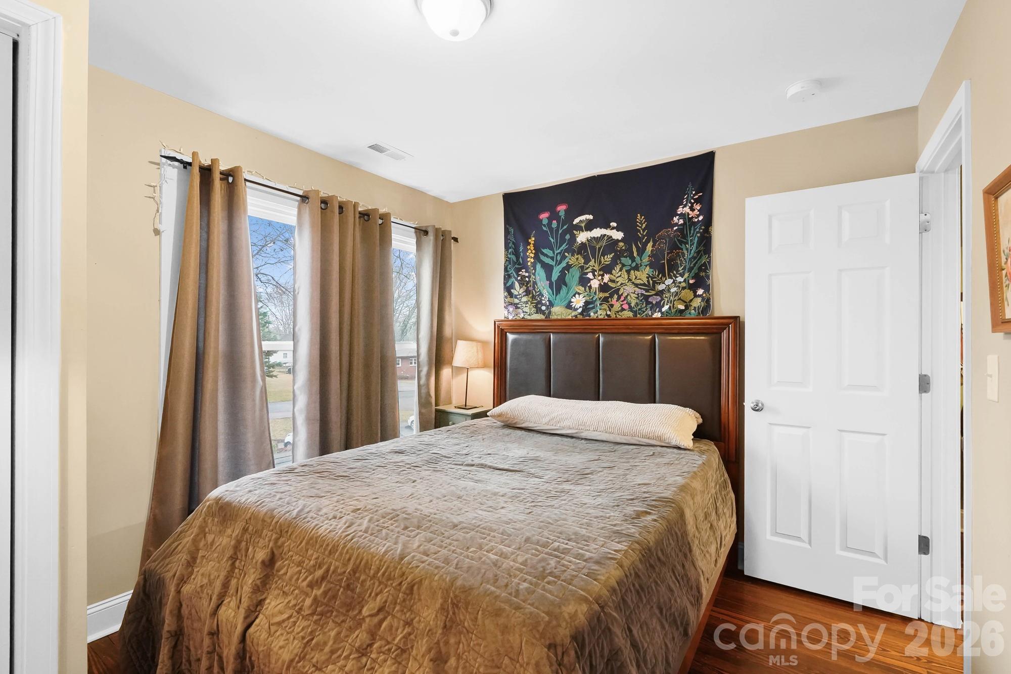 514 Jackson Park Road Kannapolis, NC 28083 - Photo 28 of 48 a bed sitting in a bedroom next to a window