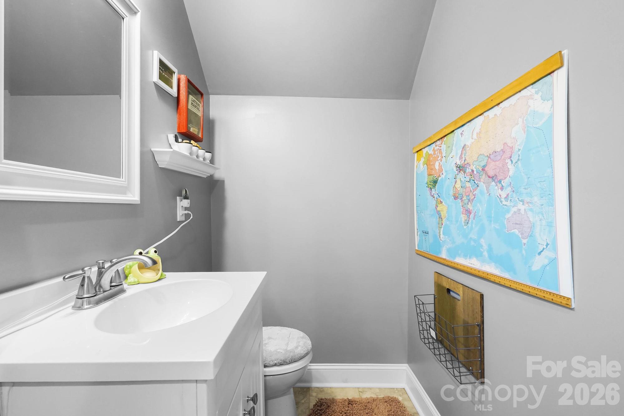 514 Jackson Park Road Kannapolis, NC 28083 - Photo 30 of 48 a bathroom with a sink mirror vanity and toilet