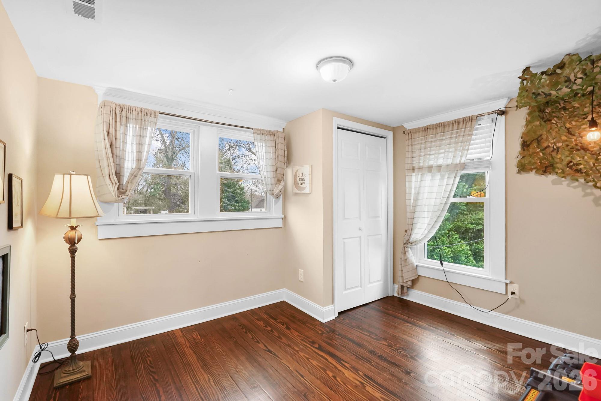 514 Jackson Park Road Kannapolis, NC 28083 - Photo 31 of 48 a view of an empty room with wooden floor and a window
