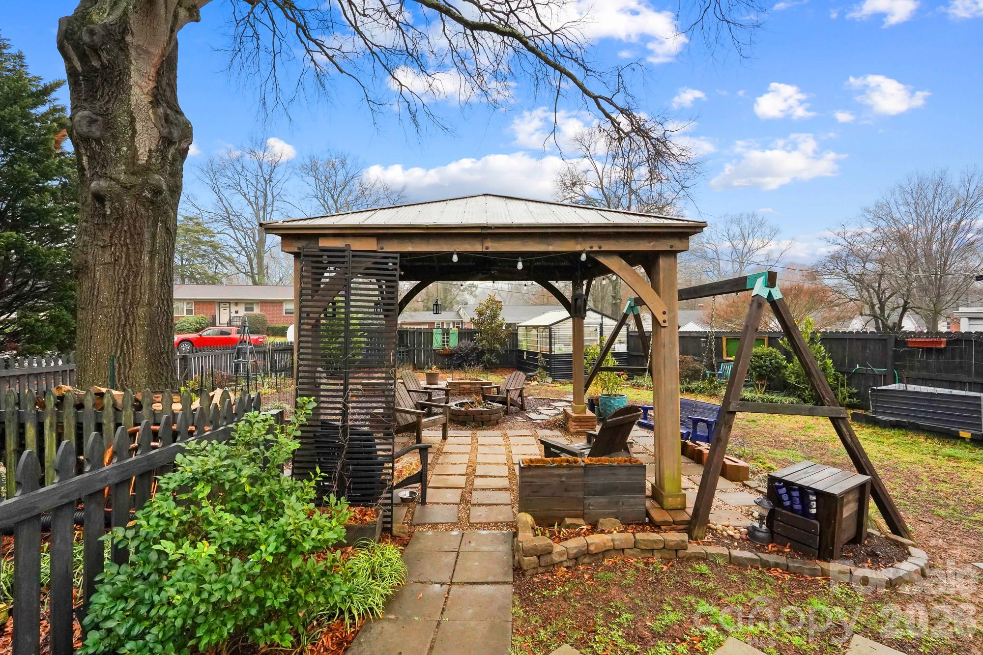 514 Jackson Park Road Kannapolis, NC 28083 - Photo 36 of 48 a view of a deck with a table and chairs