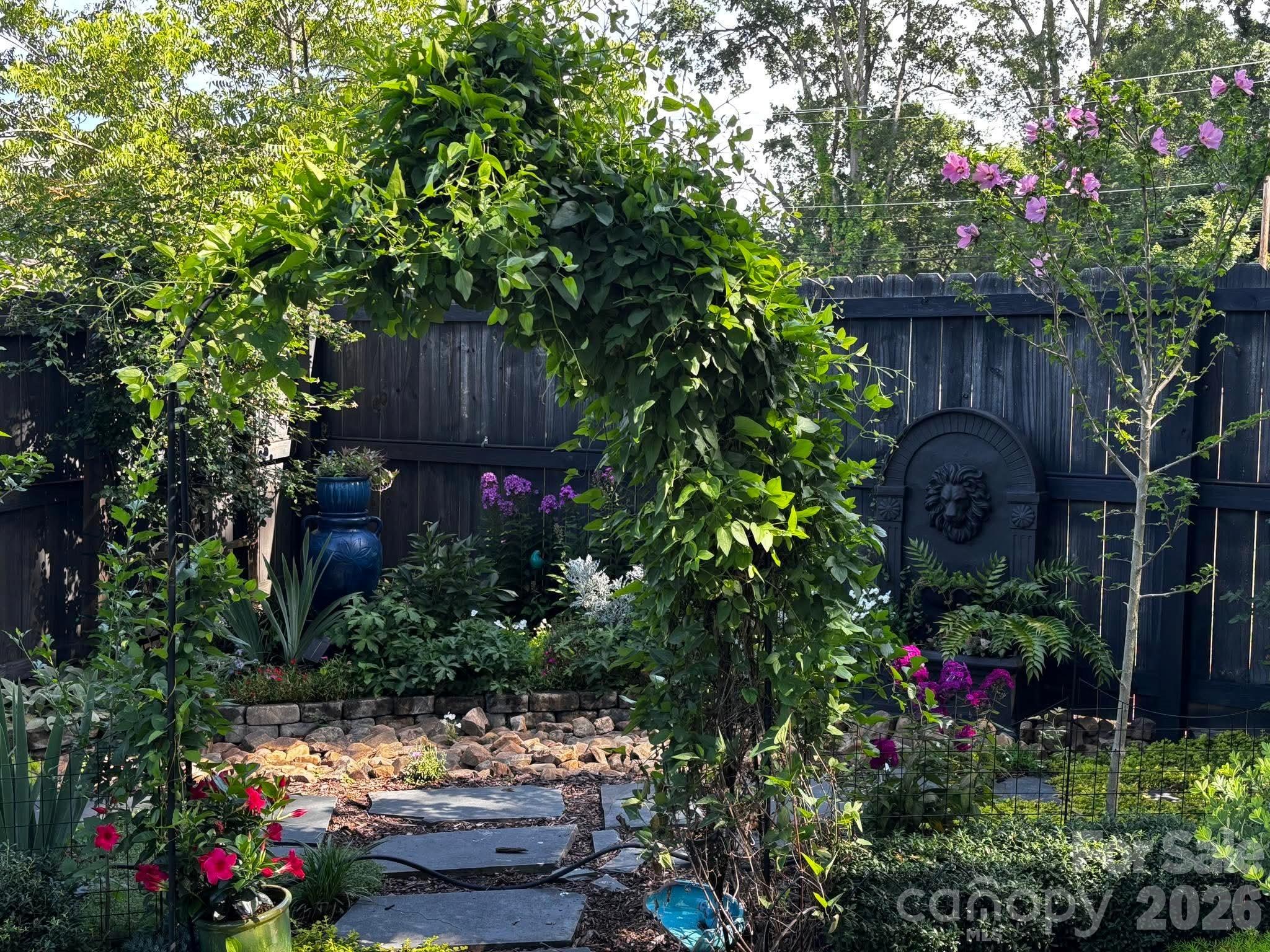 514 Jackson Park Road Kannapolis, NC 28083 - Photo 41 of 48 a view of a backyard with flowers and flowers