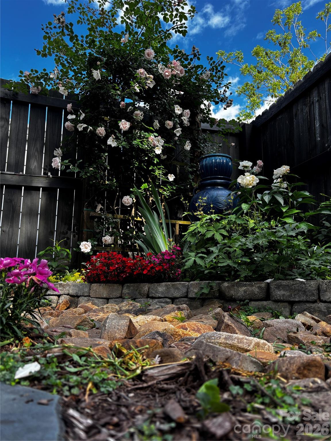 514 Jackson Park Road Kannapolis, NC 28083 - Photo 43 of 48 a view of a wooden house with a yard and a wooden fence