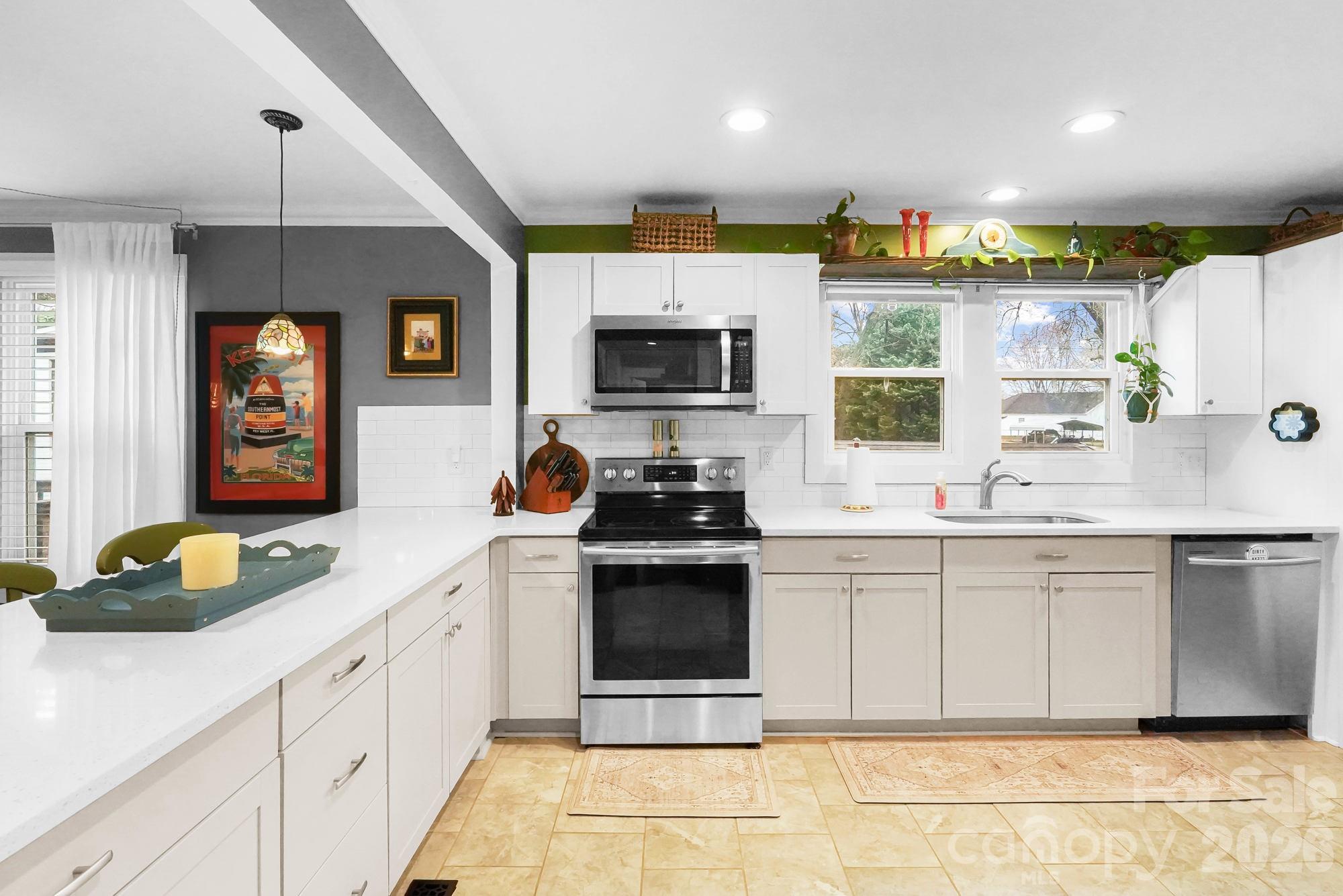 514 Jackson Park Road Kannapolis, NC 28083 - Photo 8 of 48 a kitchen with stainless steel appliances granite countertop a sink and a stove