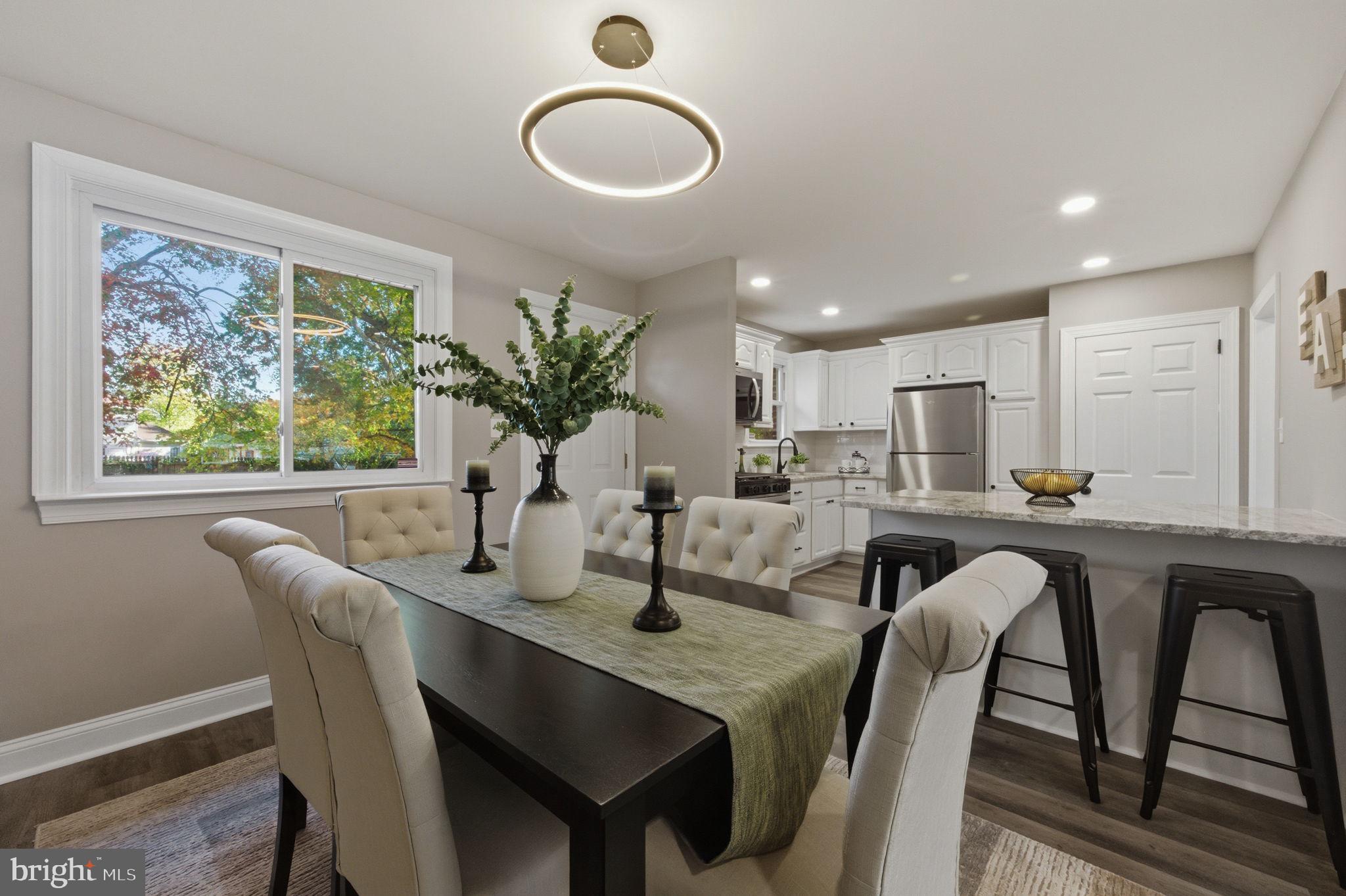 2247 Silverside Road Wilmington, DE 19810 - Photo 13 of 35 a kitchen with a table chairs sink and cabinets