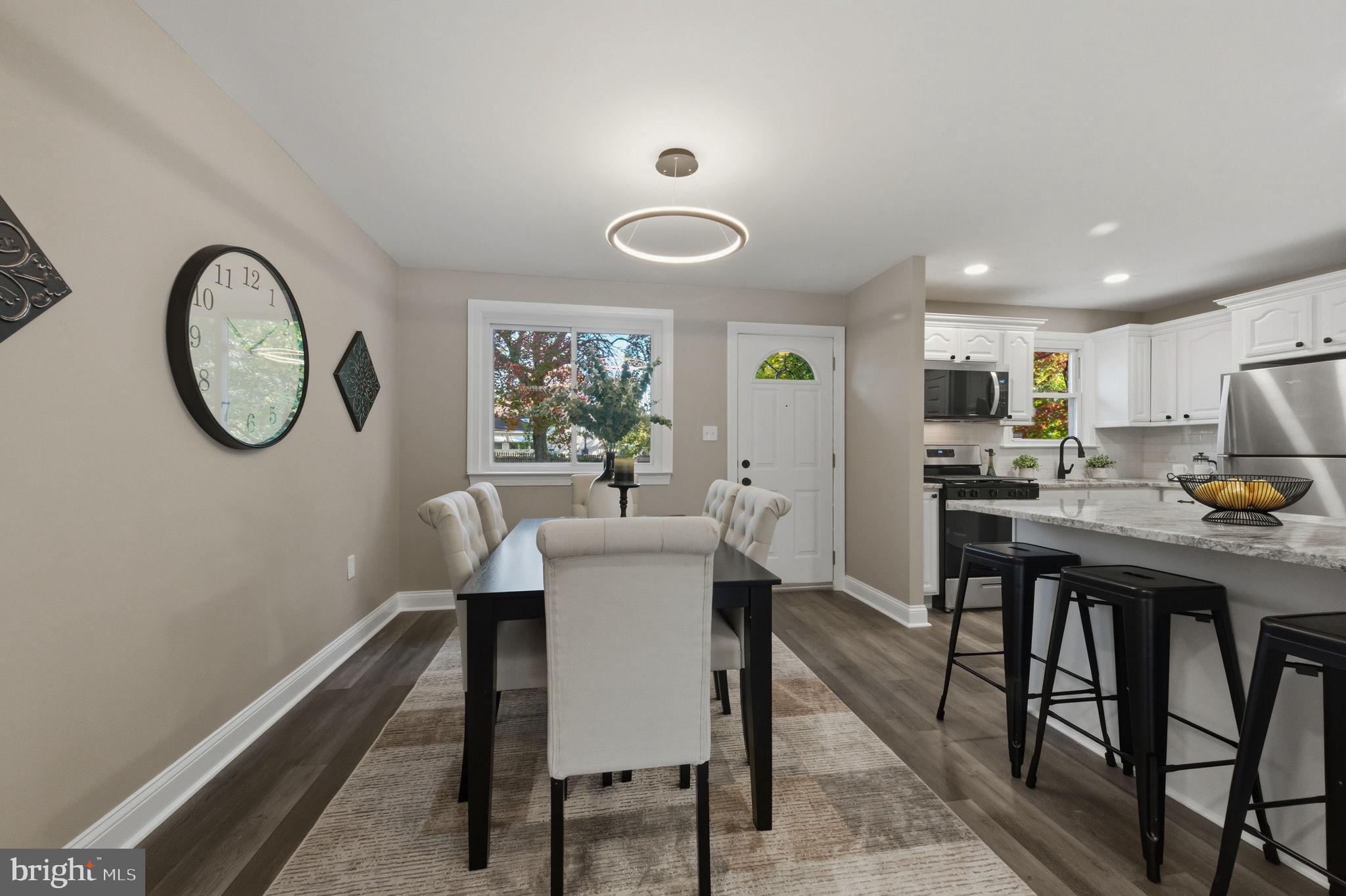 2247 Silverside Road Wilmington, DE 19810 - Photo 13 of 33 a view of a dining room with furniture a potted plant and wooden floor