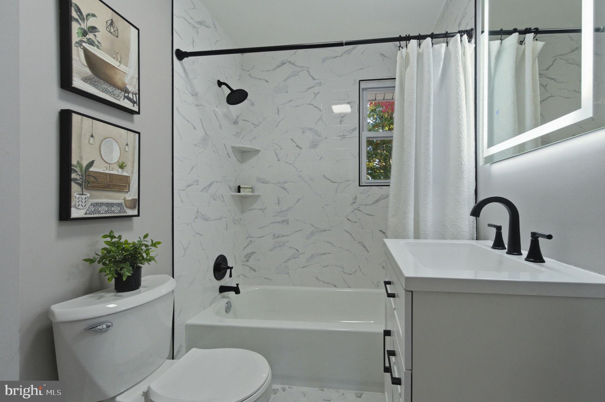 2247 Silverside Road Wilmington, DE 19810 - Photo 18 of 35 a bathroom with a sink toilet and shower