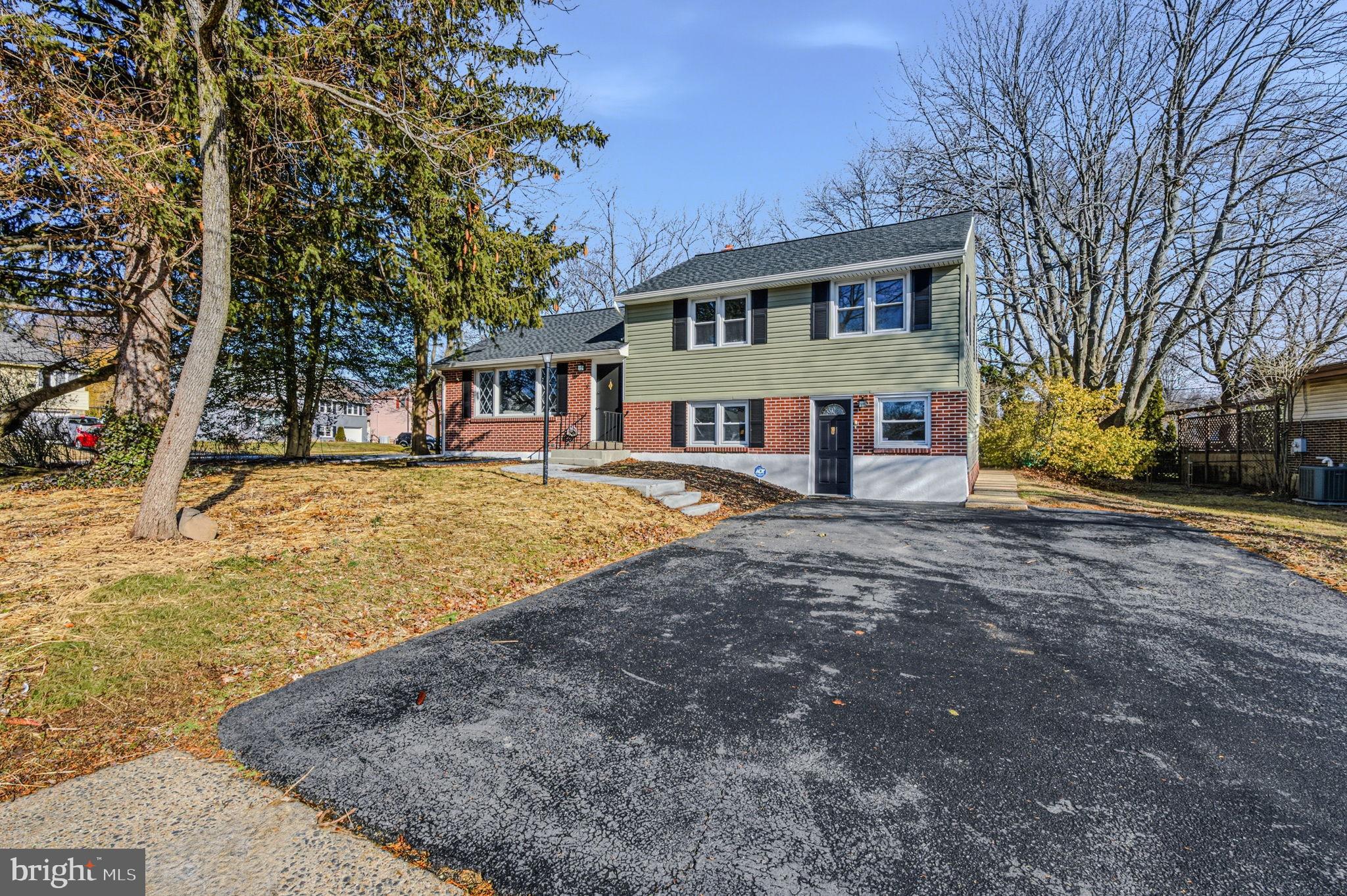 2247 Silverside Road Wilmington, DE 19810 - Photo 2 of 35 a view of a house with a yard covered with snow
