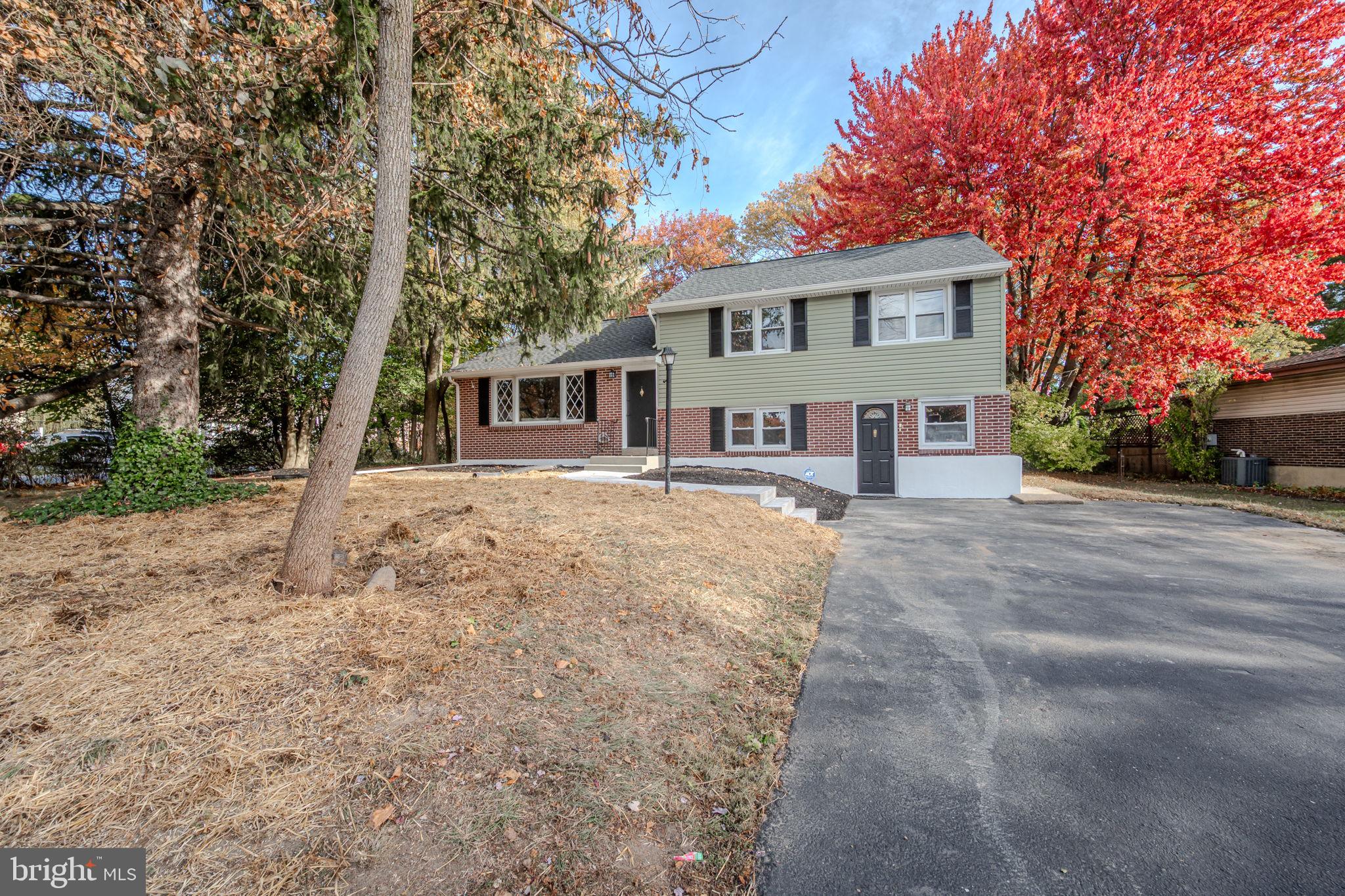 2247 Silverside Road Wilmington, DE 19810 - Photo 2 of 33 a front view of a house with a yard and trees