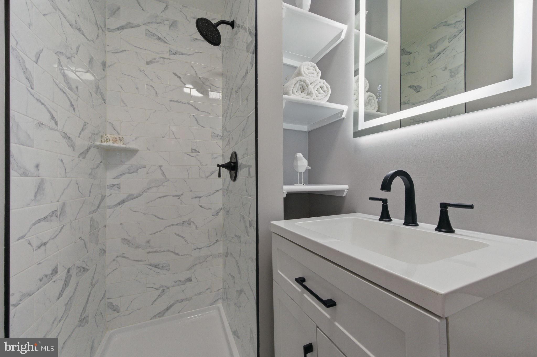 2247 Silverside Road Wilmington, DE 19810 - Photo 21 of 33 a close view of a bathroom sink and shower