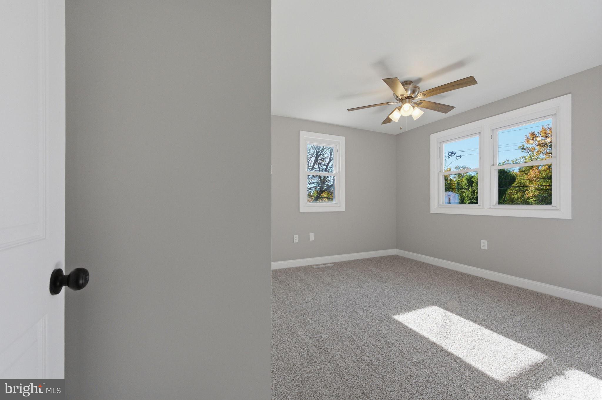 2247 Silverside Road Wilmington, DE 19810 - Photo 26 of 35 an empty room with windows and fan
