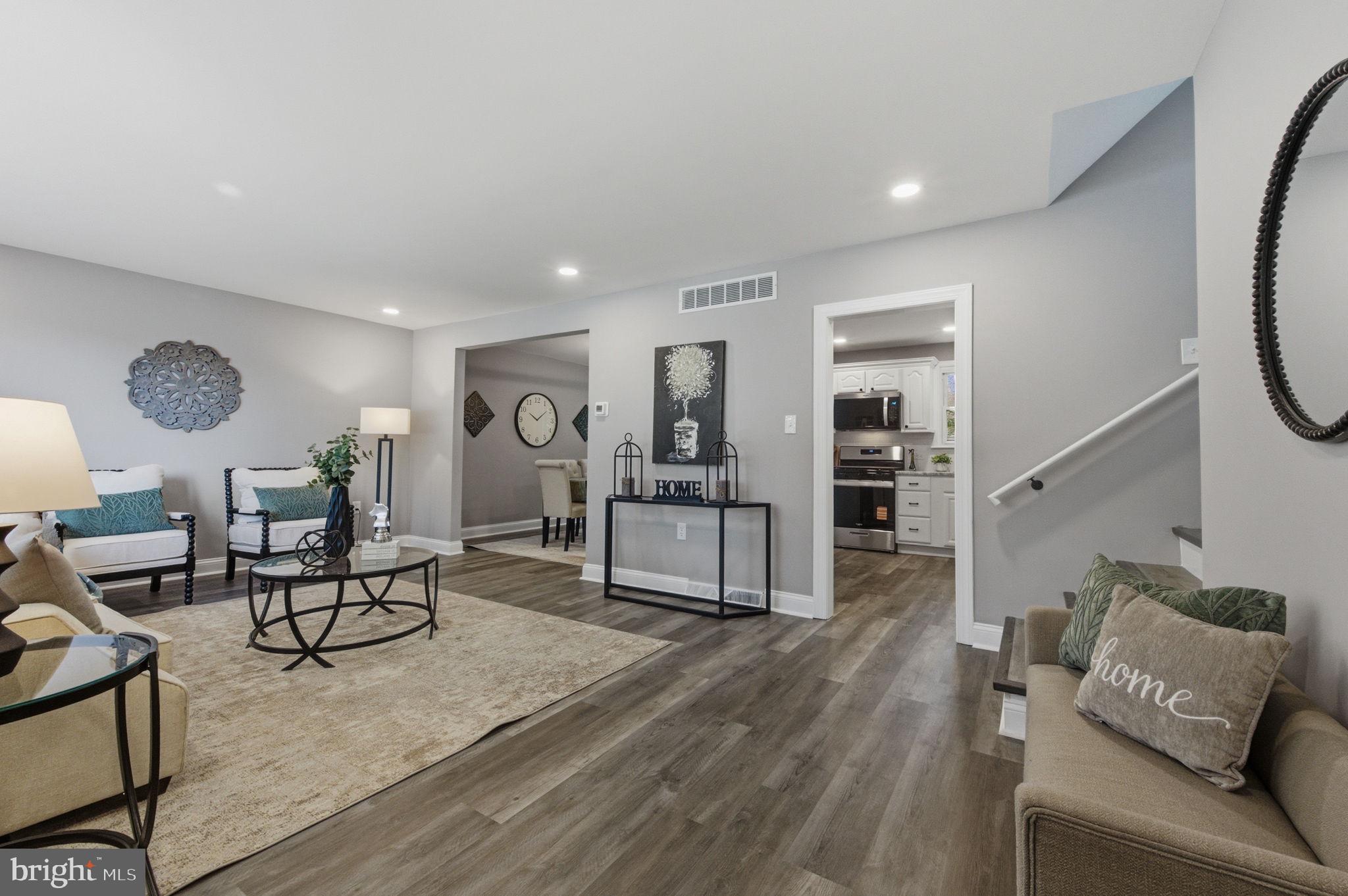 2247 Silverside Road Wilmington, DE 19810 - Photo 7 of 35 a living room with furniture and a wooden floor