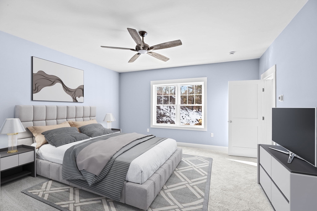 8 Beacon Street, Unit 80 Onset, MA 02558 - Photo 5 of 16 a bedroom with a bed and a tv on the dresser